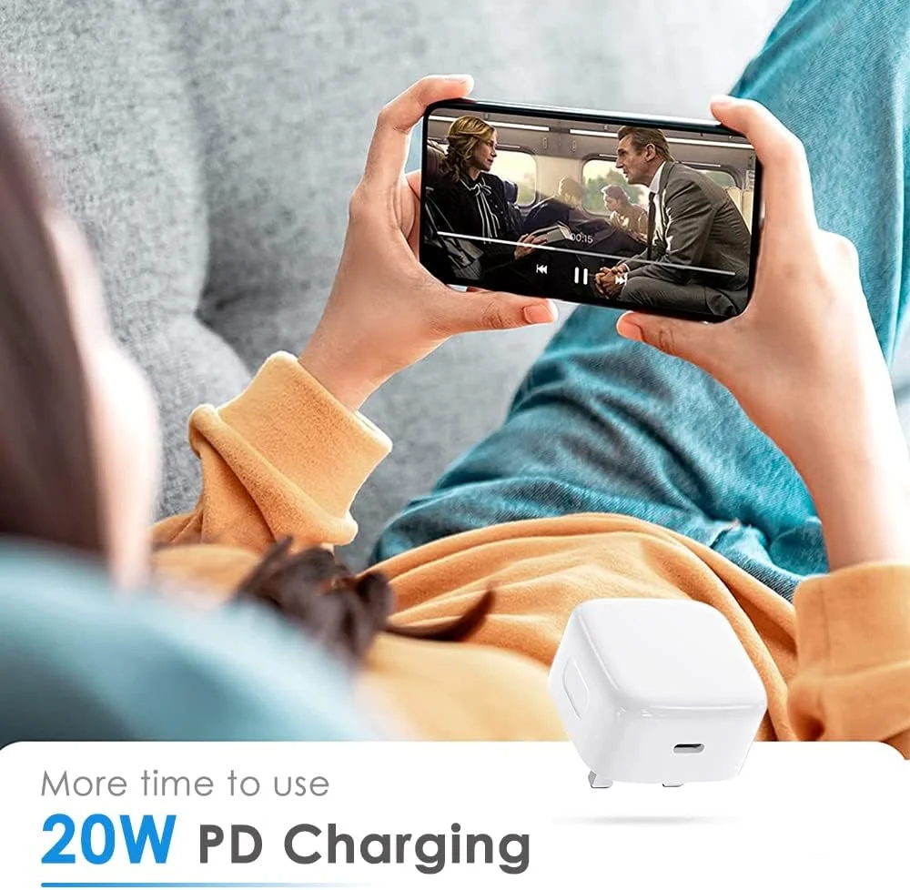 Apple USB-C Power Adapter with iPhone 15 – showing fast charging in progress
